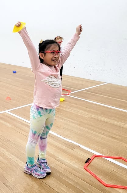 Junior player celebrating on court