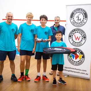 JETS team at competition with banner